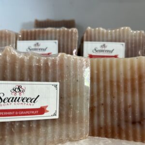 Handmade seaweed soap bars with textured edges and labels.