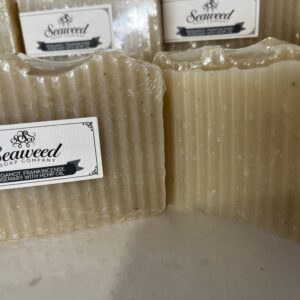 Two bars of natural, textured seaweed soap with labels.