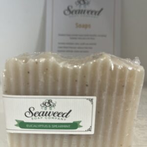 Natural seaweed soap with a wavy texture and eco-friendly label.