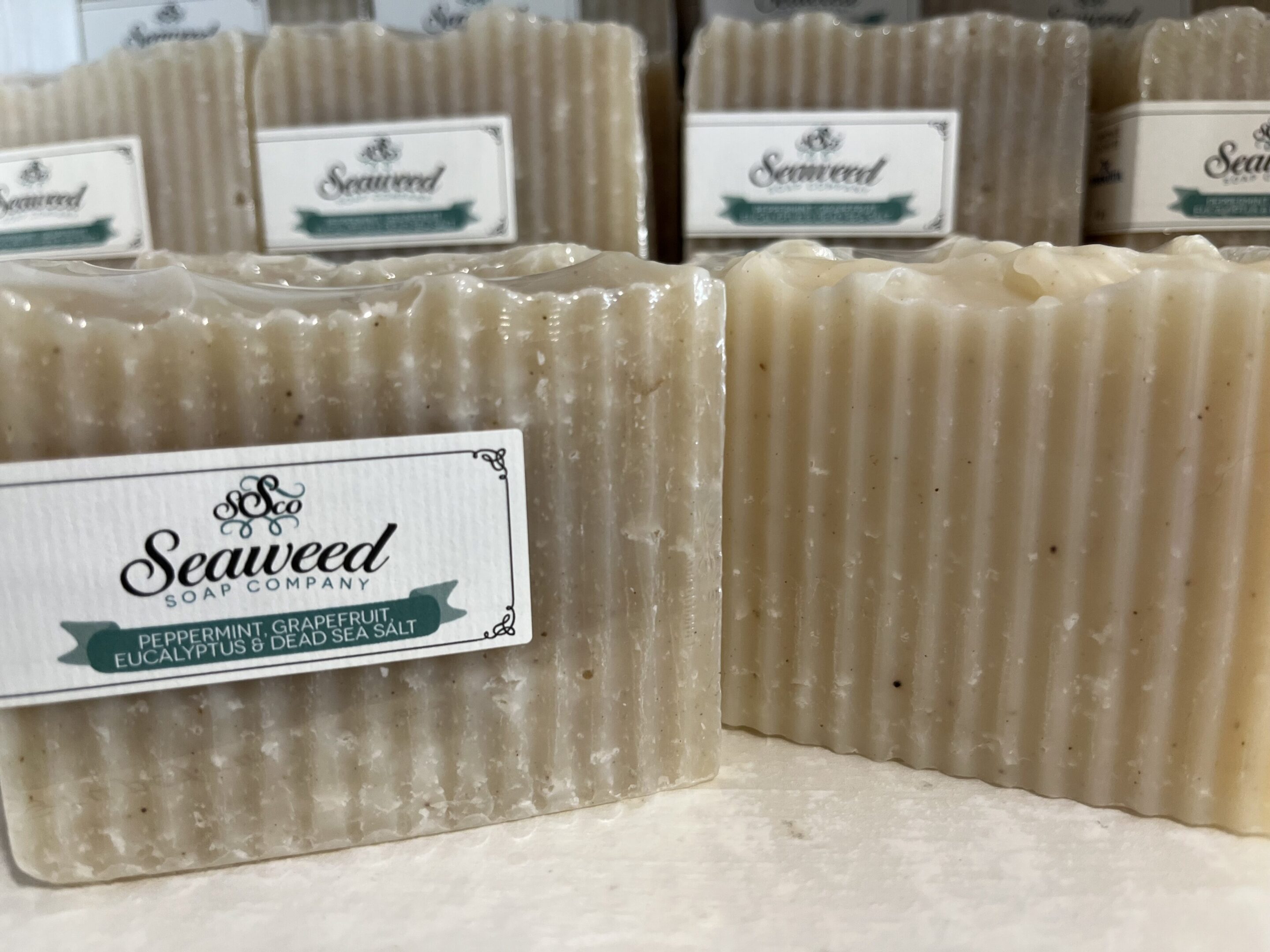 Natural seaweed soap bars with a textured surface displayed.
